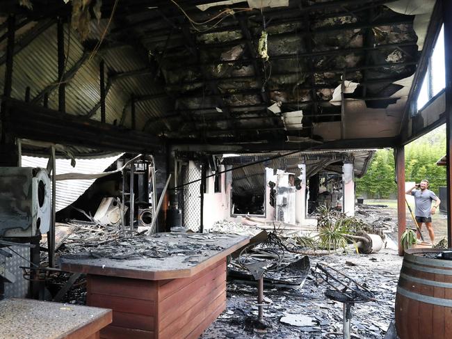 Bevin Cunniffe looks into the ruins of his home yesterday. Picture: Liam Kidston