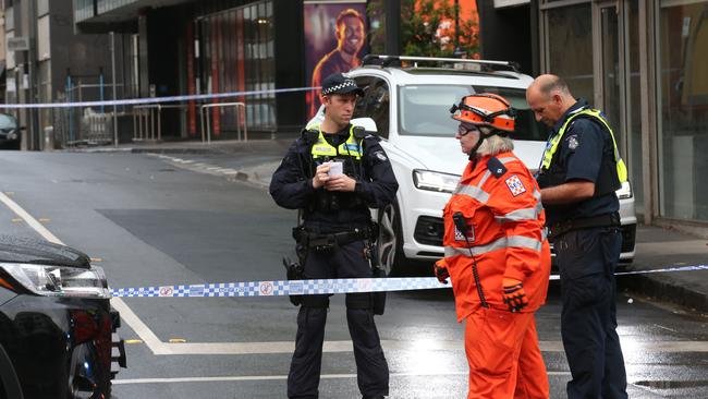 Police are inspecting a white Audi SUV. Picture: David Crosling