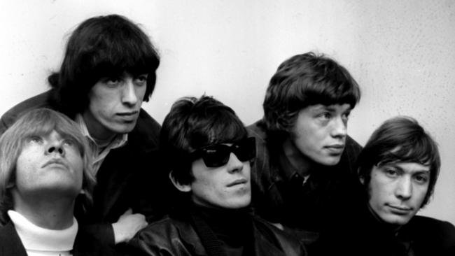 Brian Jones, left, Bill Wyman, Keith Richards, Mick Jagger and Charlie Watts at Sydney airport in 1966. Picture: Mike Bromley