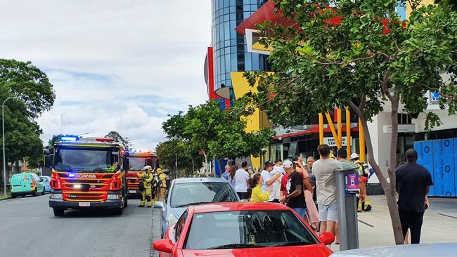 A Southport tower being evacuated after a fire broke out in a unit. Picture: Luke Mortimer