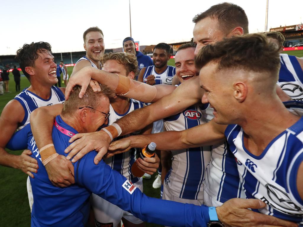 Senior coach David Noble of the Kangaroos celebrates a win with his players.