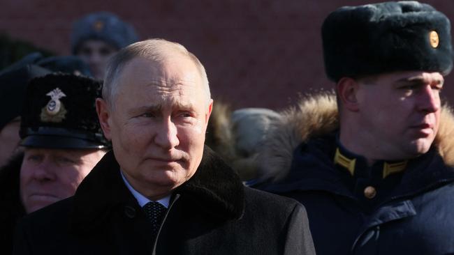 Russian President Vladimir Putin attends a wreath-laying ceremony at the Eternal Flame and the Unknown Soldier's Grave during an event marking Defender of the Fatherland Day in Moscow. Picture: AFP.