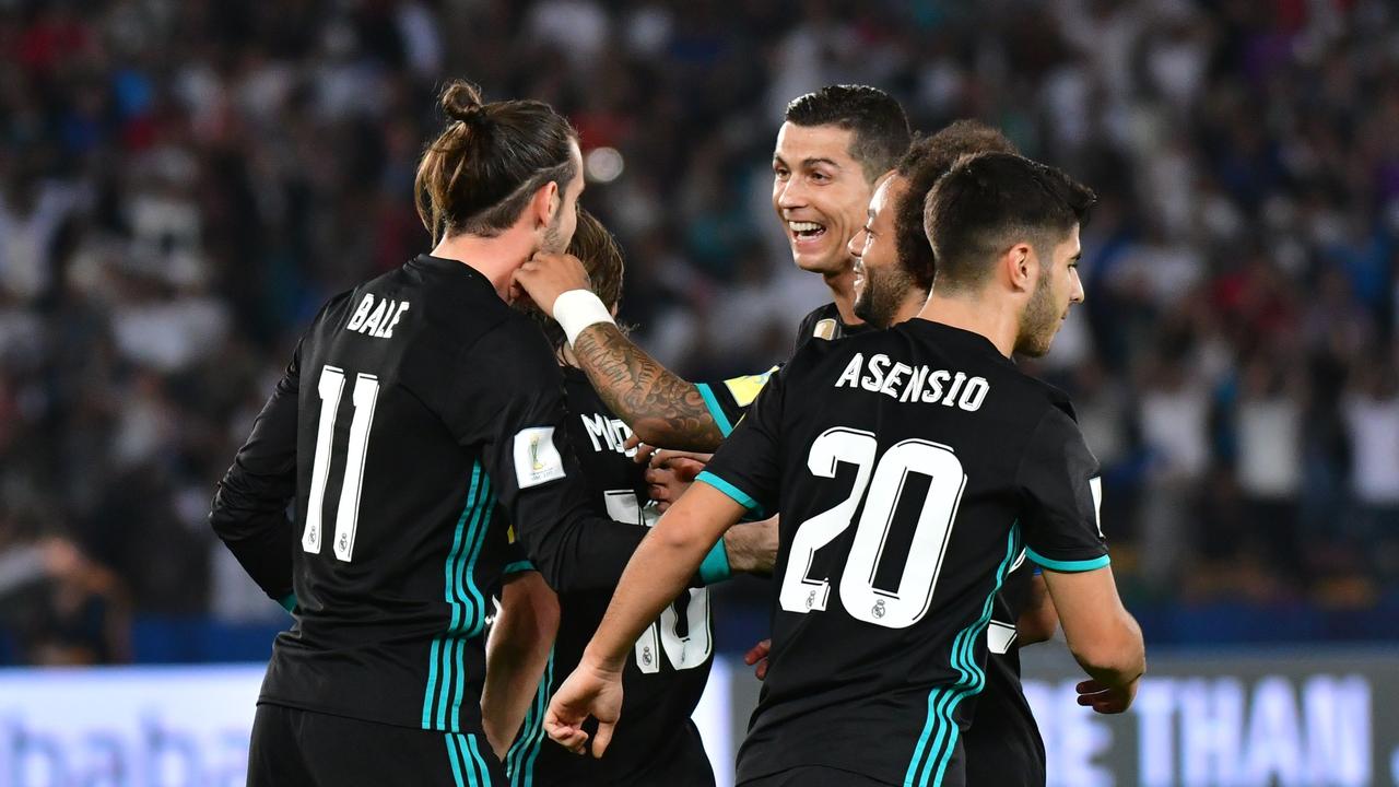 Real Madrid's Welsh forward Gareth Bale (L) is congratulated after scoring by teammates Luka Modric, Cristiano Ronaldo, Marcelo and Sergio Asensio