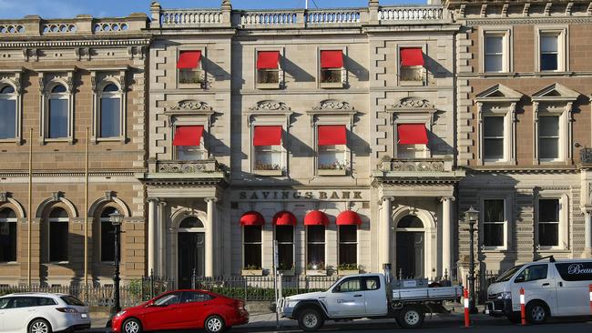 The controversial red awnings on the old Savings Bank of Tasmania building in Murray Street, Hobart. Photo: MATT THOMPSON