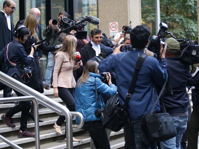 The media huddle as Arthur Moses leaves the Federal Court in Sydney on Thursday. Picture: Christian Gilles