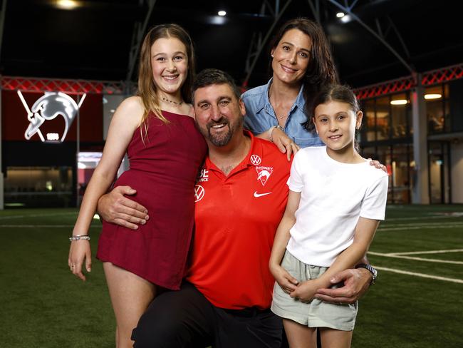 Dean Cox with his wife Kerry and daughters Charlotte and Isabella after being appointed Swans head coach. Picture: Phil Hillyard