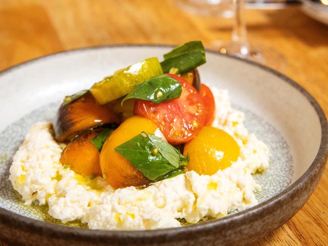 Stracciatella and heirloom tomatoes. Picture: Mark Stewart