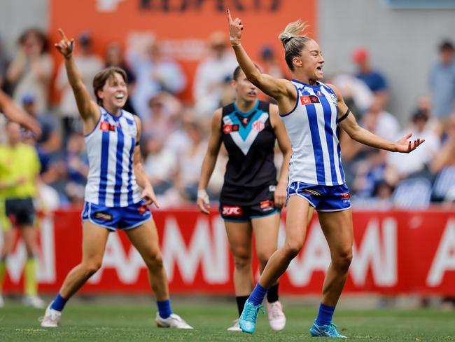 MELBOURNE, AUSTRALIA - NOVEMBER 23: Alice O'Loughlin of the Kangaroos celebrates a goal during the 2024 AFLW First Preliminary Final match between the North Melbourne Tasmanian Kangaroos and the Port Adelaide Power at IKON Park on November 23, 2024 in Melbourne, Australia. (Photo by Dylan Burns/AFL Photos via Getty Images)