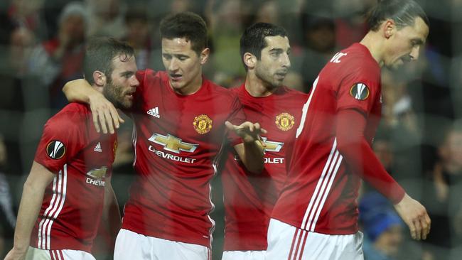 United players celebrate after Juan Mata scored against Rostov.