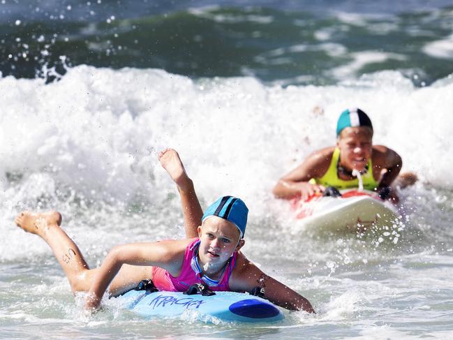 Heidi Kable competes in the U/13 board paddle during the surf carnival at Clifton Beach. Picture: Chris Kidd