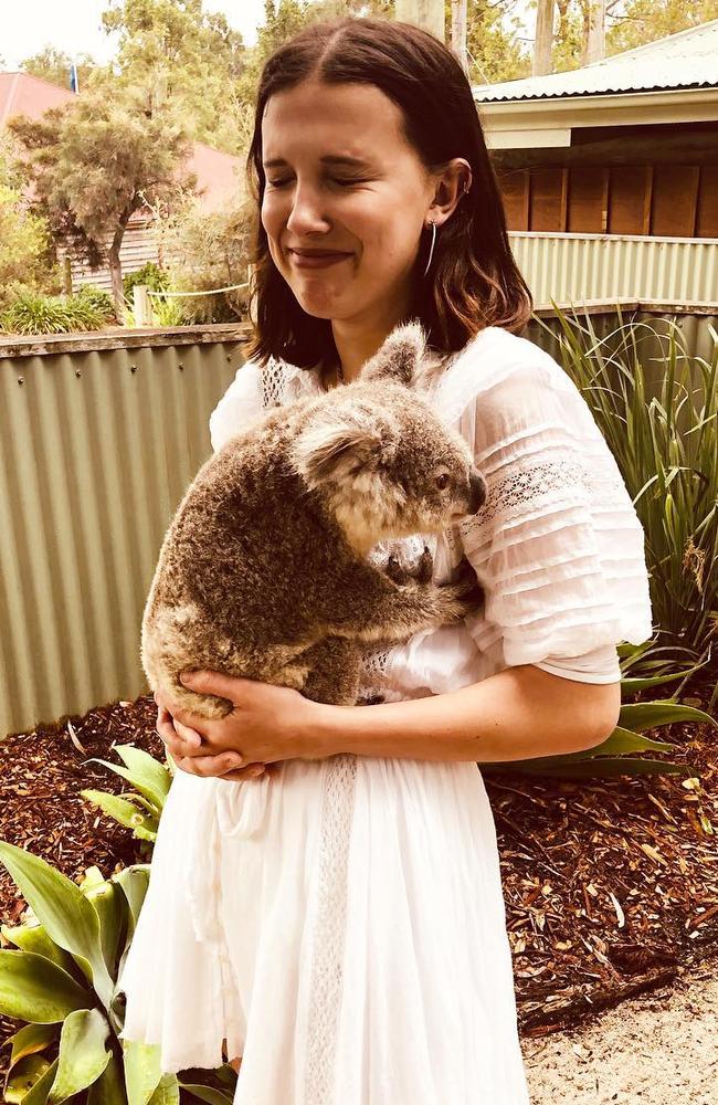 Actor Millie Bobby Brown cuddles a koala in Brisbane on Saturday. Photo: Instagram @milliebobbybrown