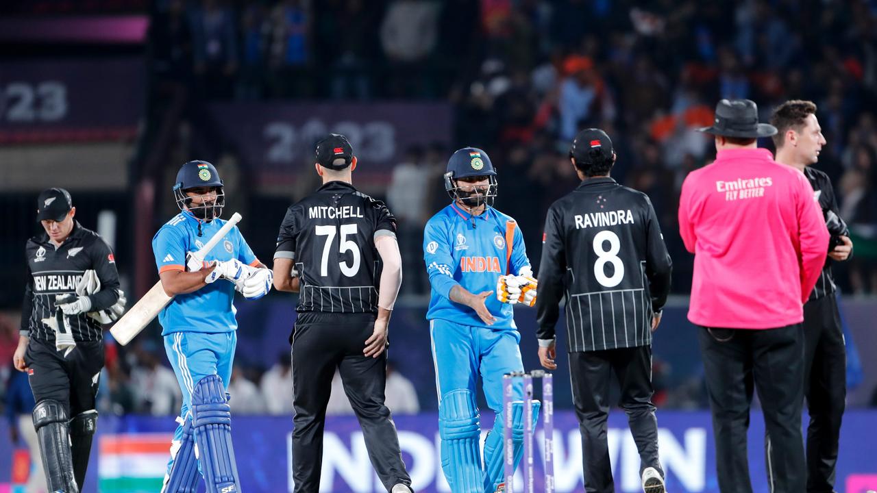 Both teams shake hands following the ICC Men's Cricket World Cup India 2023 match between India and New Zealand at HPCA Stadium on October 22, 2023 in Dharamsala, India. (Photo by Surjeet Yadav/Getty Images.