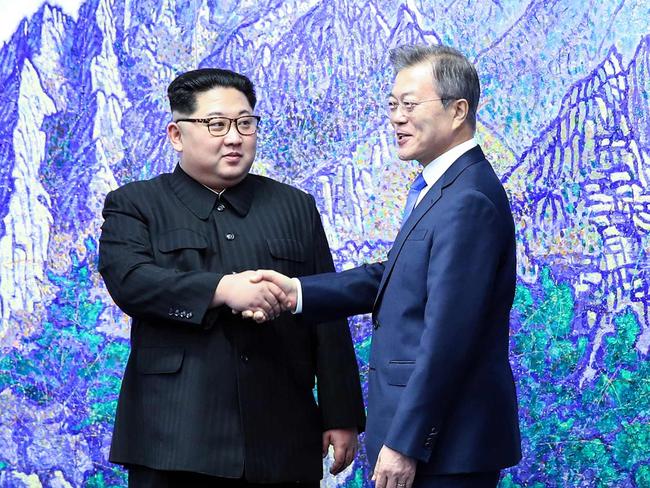 North Korea's leader Kim Jong Un and South Korea's President Moon Jae-in pose for a photo during their summit in the Peace House building. Picture: AFP