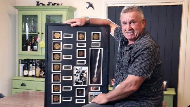 Port Adelaide champion Greg Phillips with his impressive collection of Port Adelaide SANFL premiership medals. Picture: Dean Martin