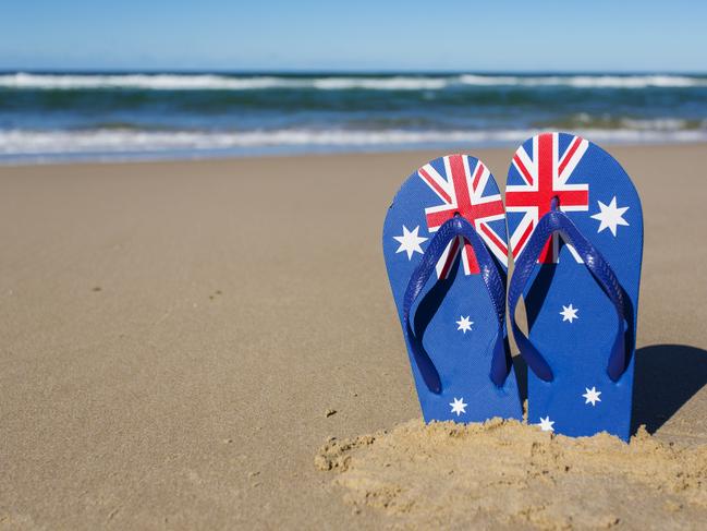 Australian flag flip flop thongs on a beach