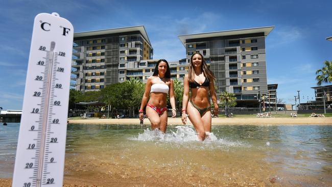 Melbourne tourists Chelsea and Jessica Menhenett having a dip at the Darwin Waterfront. Picture: Katrina Bridgeford.