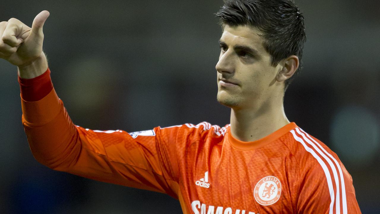 Chelsea's goalkeeper Thibaut Courtois gestures as he walks from the pitch after his team's 3-1 win at Burnley in their English Premier League soccer match at Turf Moor Stadium, Burnley, England, Monday Aug. 18, 2014. (AP Photo/Jon Super)