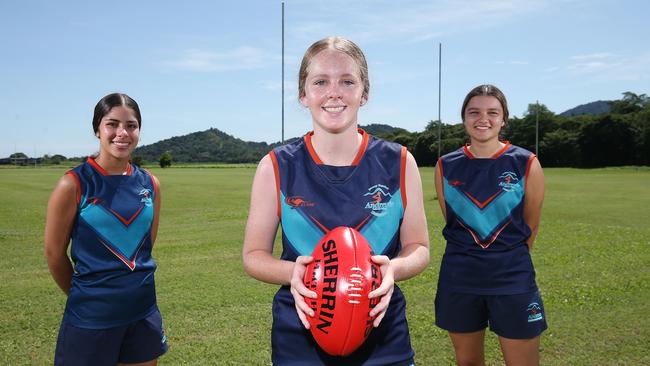 The St Andrew's Catholic College senior girls AFL team has won the Far North Queensland School's Cup for the second year in a row. Reshan Narula, 17, Alyssa Gall, 16, and Sienna Little, 16, will now head to the North Queensland championships in Townsville. Picture: Brendan Radke