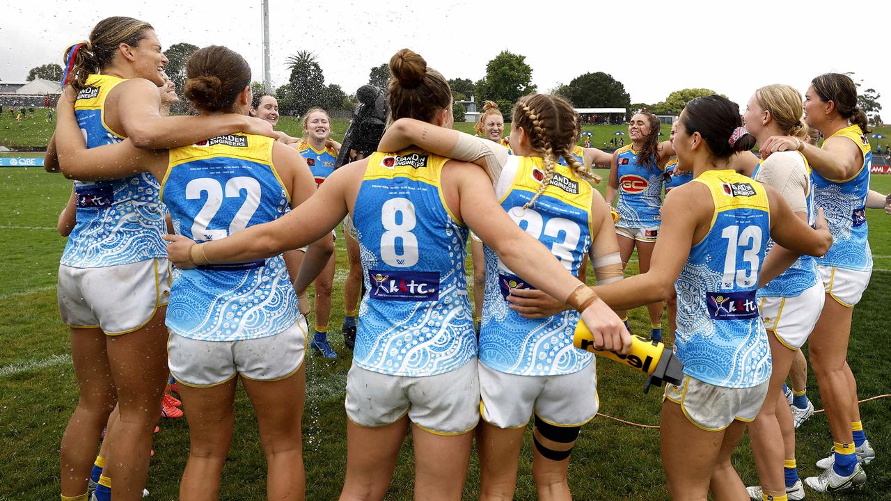 Gold Coast celebrate their win. Picture: Phil Hillyard