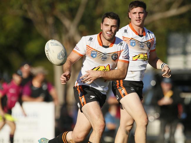 Tigers hooker Nathan Rumsby finds support. Picture: Warren Gannon Photography