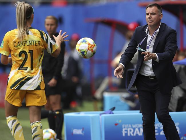 Australia head coach Ante Milicic, right, tosses the ball to Australia's Ellie Carpenter, left, during the Women's World Cup Group C soccer match between Australia and Italy at the Stade du Hainaut in Valenciennes, Sunday, June 9, 2019. (AP Photo/Francisco Seco)