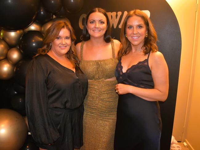 Sarah Cooper, Hayley Cameron and Amie Hood having a great night at the Cowwarr Saints Football &amp; Netball Club Golden Gala Ball 2024. Picture: Jack Colantuono