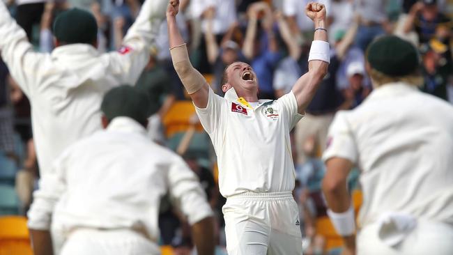 Peter Siddle (C) celebrates his hat trick at the Gabba on his birthday in 2010.