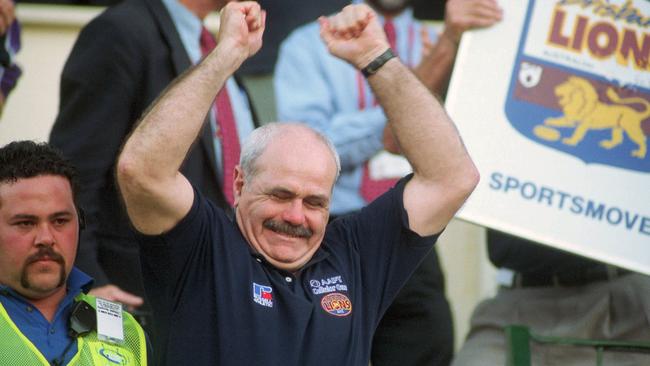 Leigh Matthews celebrates Brisbane’s 2001 premiership win.