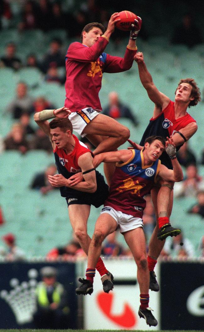 The spring-heeled Darryl White takes a screamer over a pack of players. Picture: Colleen Petch