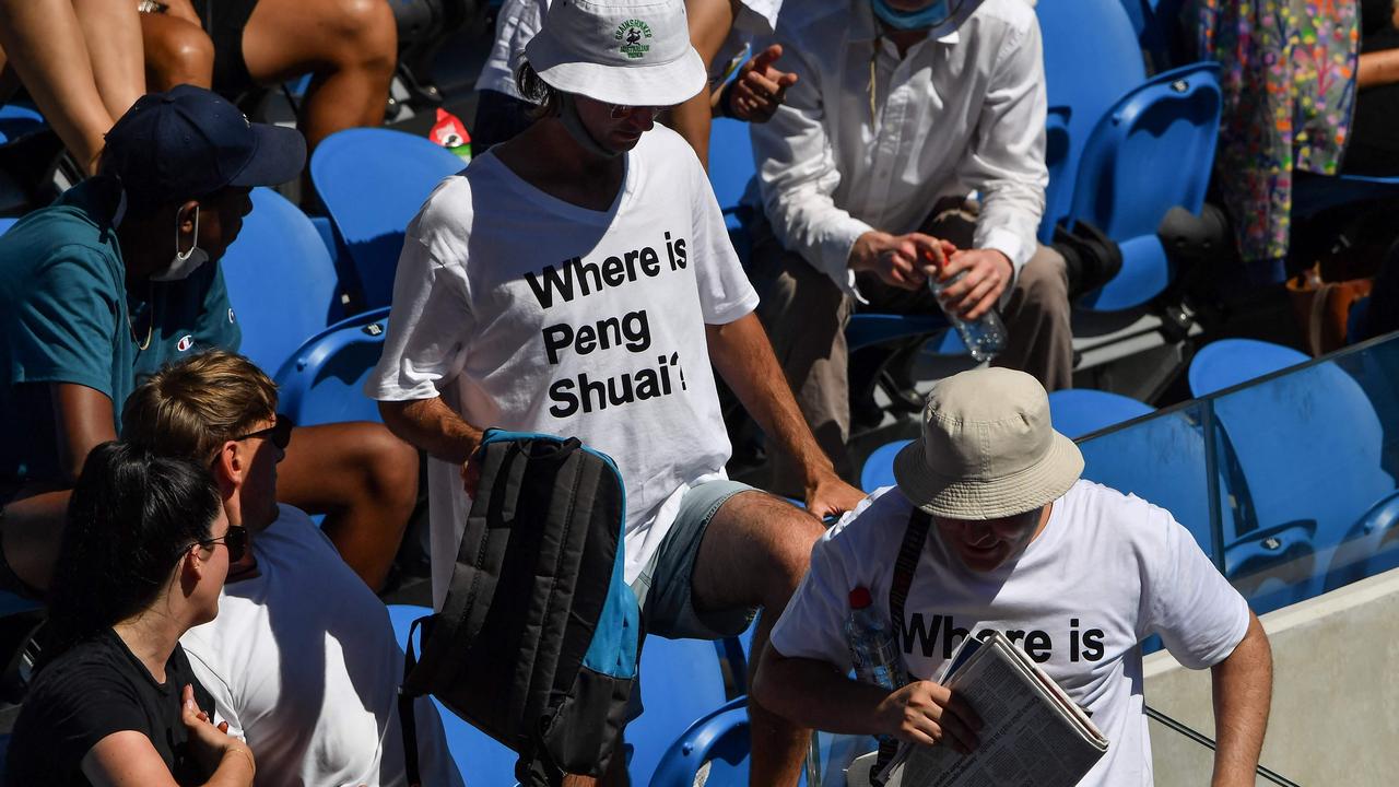 Two spectators wearing ‘Where is Peng Shuai?’ T-shirts are pictured in the stands on day nine of the Australian Open. Picture: Paul Croc/AFP