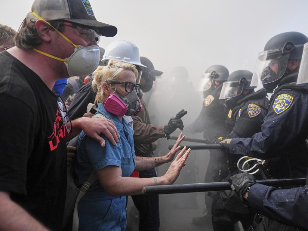Protesters confront police on the 101 Freeway near the detention centre in downtown LA. Picture: AP