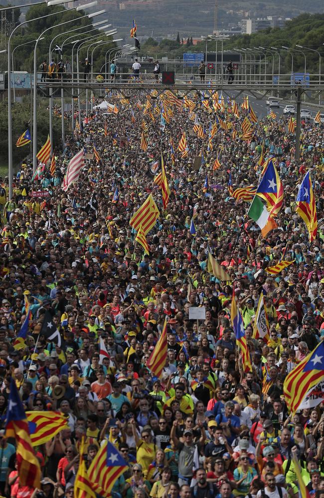 Protesters march on the streets of Barcelona. Picture: AP