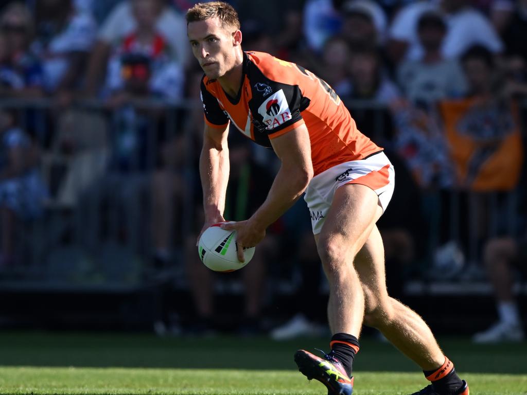 Alex Lobb of the Wests Tigers passes the ball during an NRL Pre-season challenge match. Picture: Kai Schwoerer/Getty Images