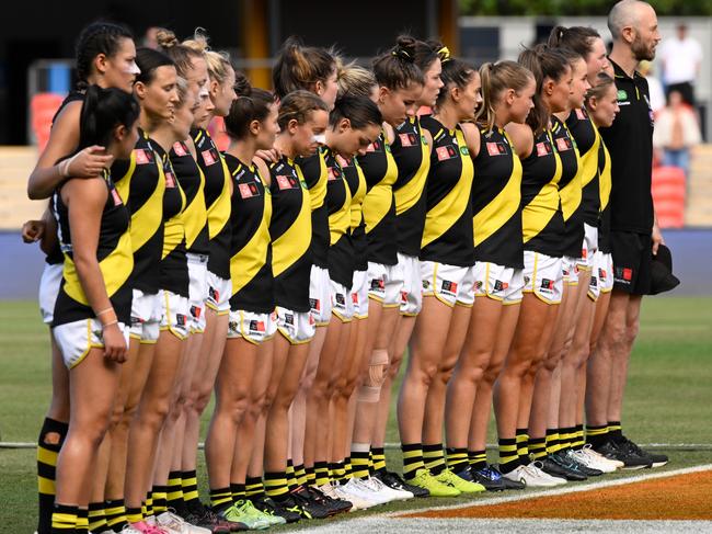 GOLD COAST, AUSTRALIA - NOVEMBER 05: Tigers players stand together during the welcome to country prior to the start of the AFLW Qualifying Final match between the Brisbane Lions and Richmond Tigers at Metricon Stadium on November 05, 2022 in Gold Coast, Australia. (Photo by Matt Roberts/Getty Images)