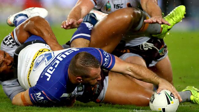 Bulldog Josh Reynolds scores a try against the Brisbane Broncos at ANZ Stadium. Picture: Gregg Porteous