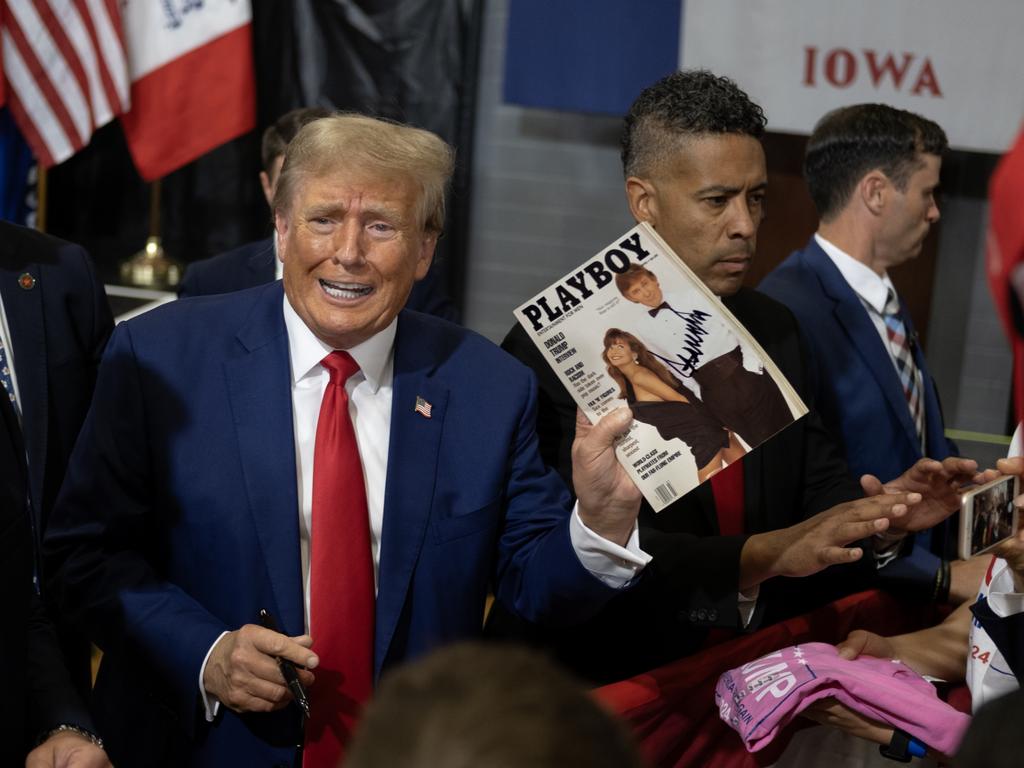Donald Trump signs his 1990 Playboy cover after addressing supporters at the Fort Dodge Senior High School in Iowa. Picture: Jim Vondruska/Getty Images