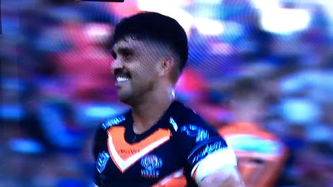 Wests Tigers' Tyrone Peachey smirks on his way to the sin bin. Fox League