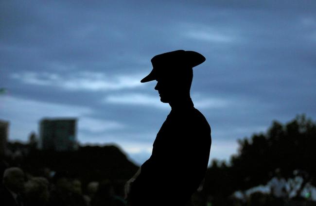 A solider stands guard during an Anzac Day dawn service. Picture: Scott Powick