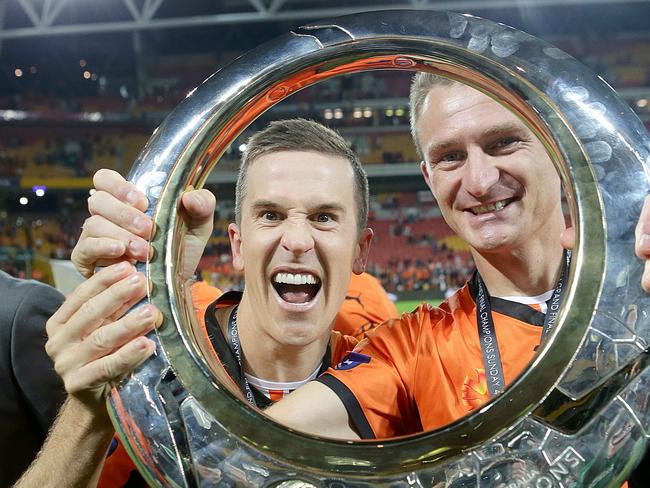 Besart Berisha (right) celebrates winning the A-League title in 2014 with then Roar teammate Matt McKay. Picture: Jono Searle