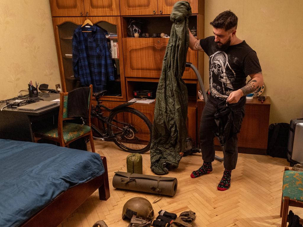 28 year-old Anton Lytvyn packs his military equipment at his house after he was called up to active duty in Kyiv, Ukraine. Picture: Getty Images