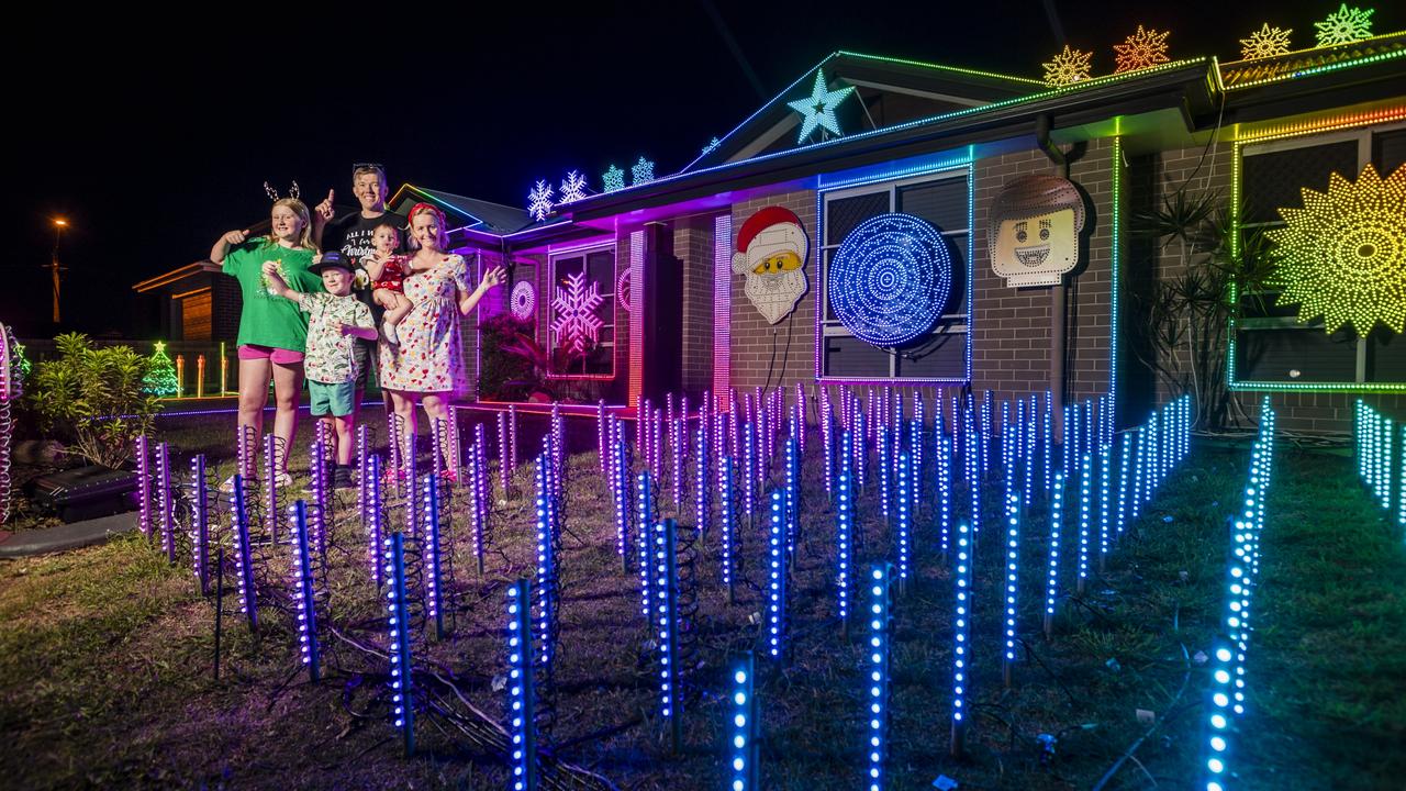 The Kearneys Spring Christmas lights display of the Scarborough family (from left) Kaitlyn Scarborough, Archie Scarborough, John Scarborough and Nicole Scarborough holding Lily Maskill. Picture: Kevin Farmer