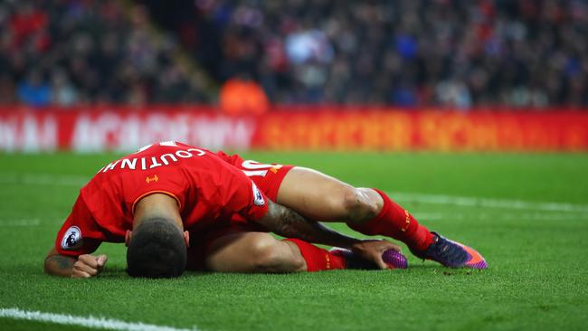 Philippe Coutinho of Liverpool lies injured during the Premier League match against Sunderland at Anfield.