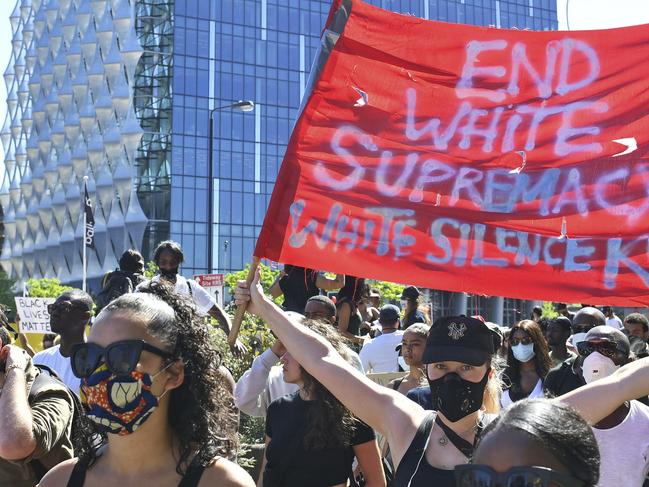 People take part in a Black Lives Matter protest outside the US Embassy in London. Picture: AP