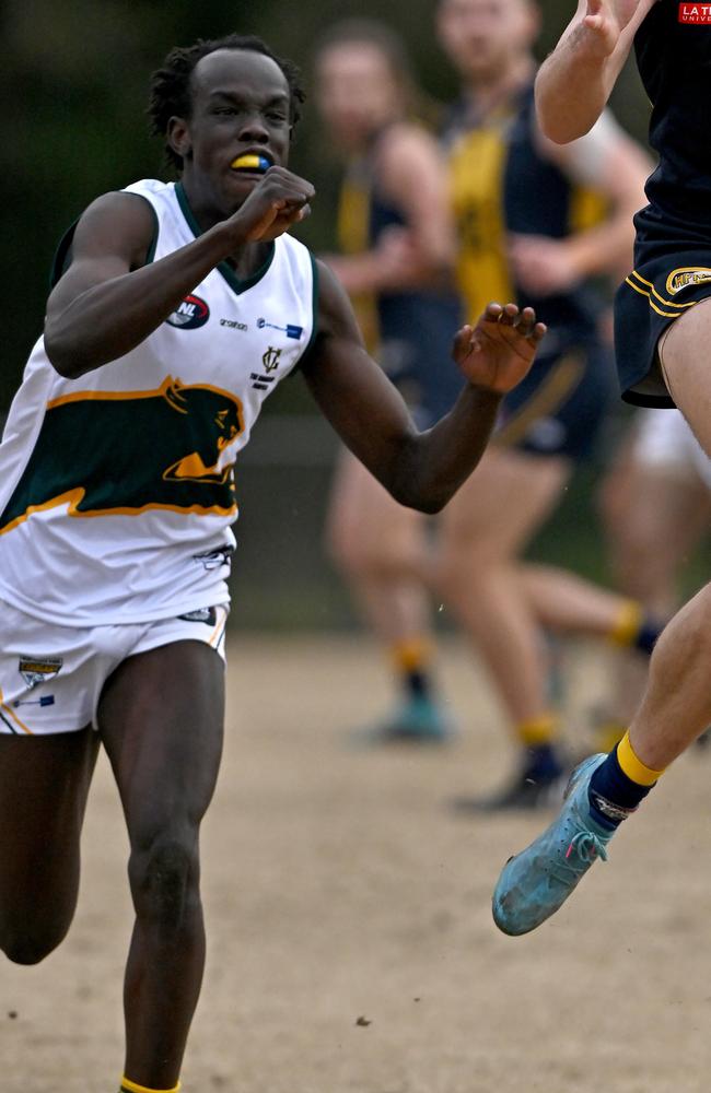 Northcote Park’s Ayui Makiemg competes for the ball. Picture: Andy Brownbill