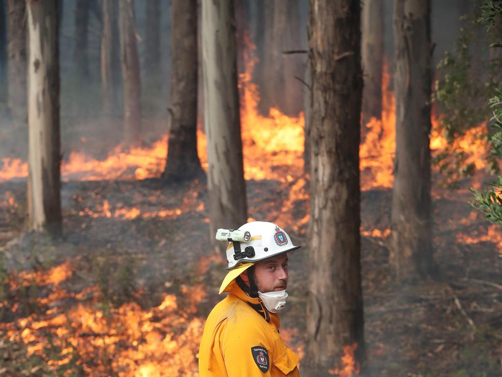 January 2019 Tasmanian Bushfires. Dylan Murphy from Kingston Fire Brigade helping to put in a controlled fire break behind a home on Donnellys Rd, Geeveston, in the Huon Valley. Picture: NIKKI DAVIS-JONES