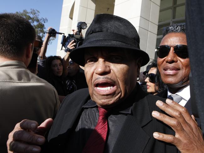 Joe Jackson and his son Jermaine Jackson, father and brother of late singer Michael Jackson, vent their fury as they leave the Airport Branch of the Los Angeles Superior Court during Murray’s trial.