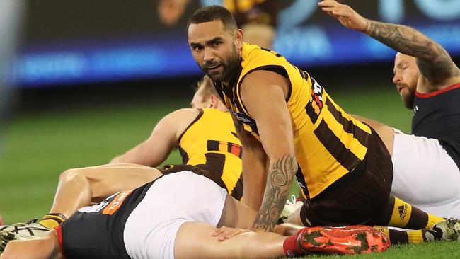 Melbourne's Angus Brayshaw after ducking into a tackle by Hawthorn's Shaun Burgoyne during the AFL semi final match between the Melbourne Demons and Hawthorn at the MCG. Picture. Phil Hillyard