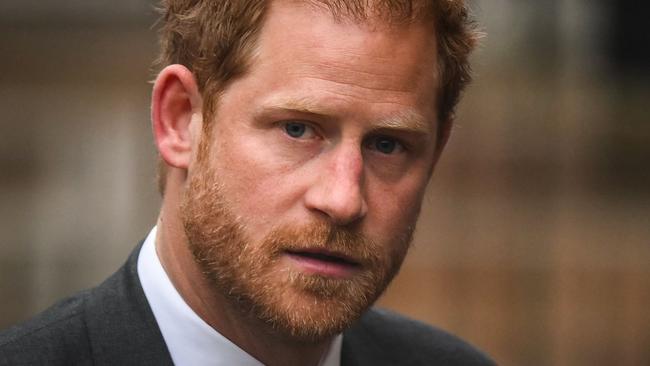 (FILES) Britain's Prince Harry, Duke of Sussex arrives at the Royal Courts of Justice, Britain's High Court, in central London on March 28, 2023. Lawyers for Prince Harry on December 5 began a legal challenge over his security arrangements in the UK, after he quit frontline royal duties and moved to North America.  The case about his loss of UK taxpayer-funded protection is the latest in a string of court proceedings initiated by Harry, whose father is King Charles III. (Photo by Daniel LEAL / AFP)