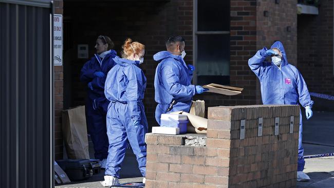 The officers were seen taking items from the home and sealing them in evidence bags. Picture: NCA NewsWire / Dylan Coker