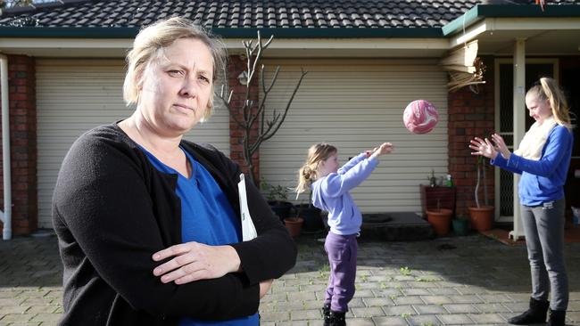 Tanya Monro, with her daughters Keeley and Laura Monro at their Mtchell Park home. Tanya is concerned about the possible contamination. Picture: Calum Robertson